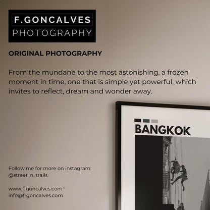 Stunning black and white photo of window cleaners on a modern Bangkok skyscraper, showcasing the vertical lines and architectural details of the city’s skyline.