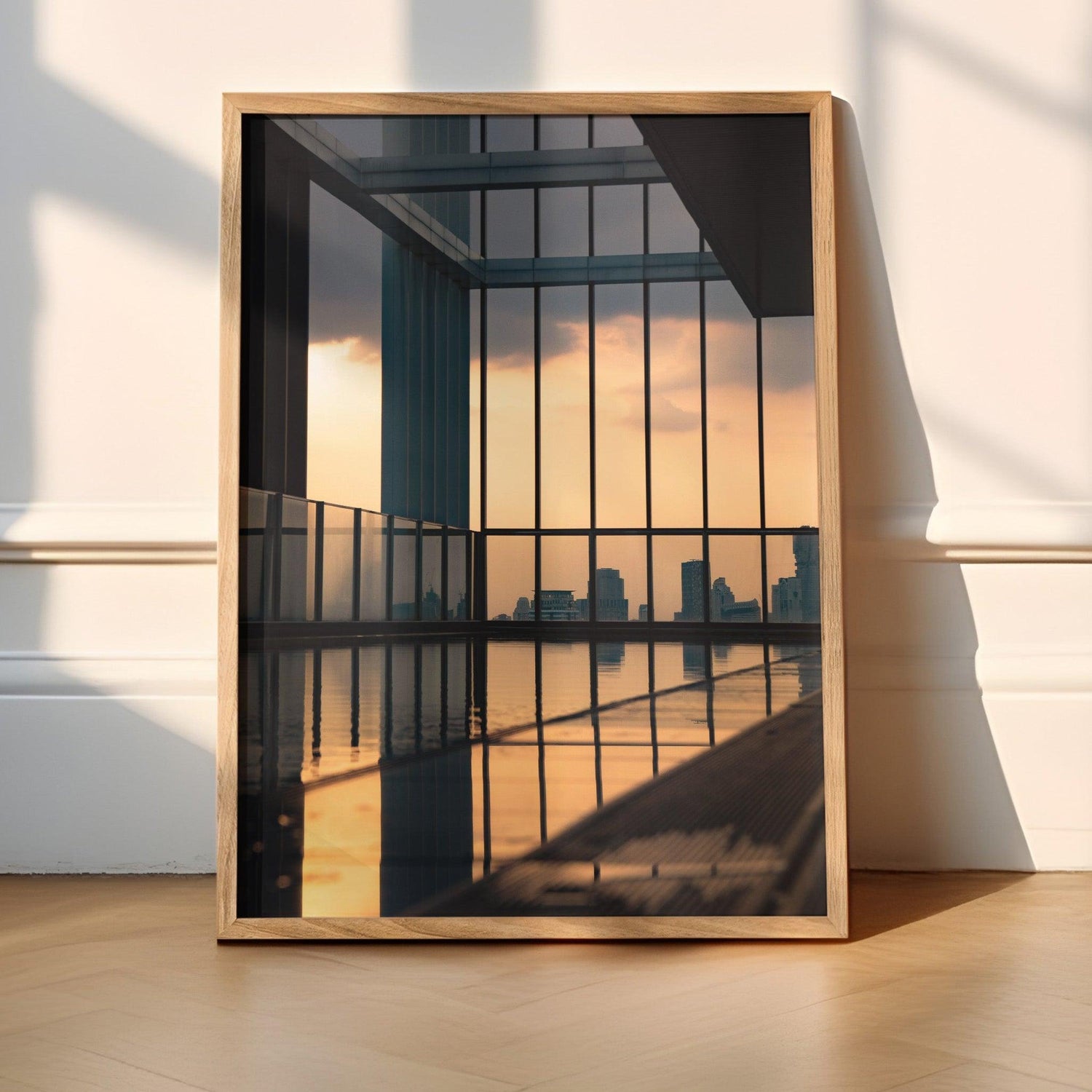 Stunning sunset over a rooftop pool in Bangkok, with warm hues reflecting on the water and a panoramic city skyline in the background, perfect for urban decor.